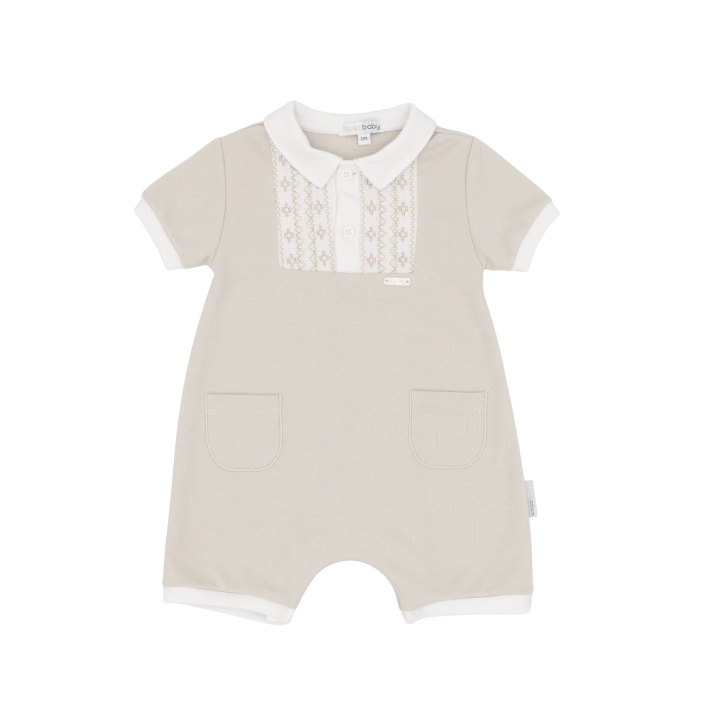 The perfect all-in-one outfit for your little one. This blues baby beige romper features a charming white collar and yoke with delicate smocking detail. Practical front pockets and easy half-button fastening at the front with poppers under the legs make dressing a breeze. Crafted from soft 100% cotton and machine washable at 30°, it's comfortable for everyday wear and simple to care for.
