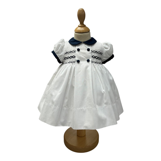 Sarah Louise - Traditional hand smocked white dress with navy trim